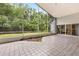 Enclosed patio offers screened views of the yard, blending indoor/outdoor living at 4026 S Lake Orlando Pkwy, Orlando, FL 32808
