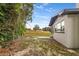 The backyard is landscaped with a wooden fence, offering privacy and space for outdoor entertaining at 4116 Sw 20Th St, Ocala, FL 34474