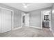 Bright bedroom featuring neutral carpet, white trim and doors, and a ceiling fan at 4116 Sw 20Th St, Ocala, FL 34474
