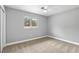 Bedroom with neutral carpet, ceiling fan and window that provides natural light at 4116 Sw 20Th St, Ocala, FL 34474