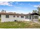 The exterior features a bright home design with a manicured lawn and inviting entrance at 4116 Sw 20Th St, Ocala, FL 34474
