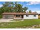 Charming single-story home featuring brick accents, an open carport, and a well-maintained lawn at 4116 Sw 20Th St, Ocala, FL 34474