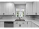 Well-lit kitchen featuring white cabinets, modern countertops, and stainless steel appliances at 4116 Sw 20Th St, Ocala, FL 34474