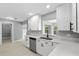 Well-lit kitchen featuring white cabinets, stainless steel appliances, and durable countertops at 4116 Sw 20Th St, Ocala, FL 34474