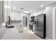 Bright kitchen showcasing stainless steel appliances, white cabinetry, and modern countertops at 4116 Sw 20Th St, Ocala, FL 34474