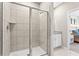 Bathroom featuring a shower and neutral decor at 427 Shoreview Sands Ave, Mascotte, FL 34753