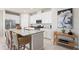 Kitchen island featuring granite countertops and ample storage, with stainless steel appliances at 427 Shoreview Sands Ave, Mascotte, FL 34753