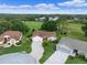 Beautiful aerial view of the property featuring a paver driveway and adjacent two-car garage at 4830 Summerbridge Cir, Leesburg, FL 34748