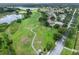 Beautiful aerial view of the golf course community featuring a winding path and lush green fairways at 4830 Summerbridge Cir, Leesburg, FL 34748