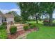 Large brick paved patio with an outdoor seating area surrounded by lush landscaping at 4830 Summerbridge Cir, Leesburg, FL 34748