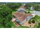 Aerial view of the home's backyard featuring a patio and well-maintained landscaping at 4830 Summerbridge Cir, Leesburg, FL 34748