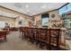 Cozy bar area with seating and a fully stocked bar with beer and liquor selections at 4830 Summerbridge Cir, Leesburg, FL 34748