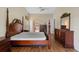 Spacious bedroom with decorative bedframe, high ceilings, and lots of natural light at 4830 Summerbridge Cir, Leesburg, FL 34748