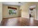 Bright bedroom featuring wood floors, ceiling fan, and a view of the Primary bath at 4830 Summerbridge Cir, Leesburg, FL 34748