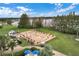 Aerial view of the driving range and putting green near a lake at 4830 Summerbridge Cir, Leesburg, FL 34748