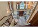 Bright foyer showcases hardwood floors, a graceful staircase, and a stylish chandelier at 4830 Summerbridge Cir, Leesburg, FL 34748