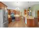 Modern kitchen with granite countertops, stainless steel appliances, and custom cabinetry offers luxury and functionality at 4830 Summerbridge Cir, Leesburg, FL 34748