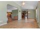 Spacious home showcasing living and dining areas with wood and tile flooring, complemented by natural light at 4830 Summerbridge Cir, Leesburg, FL 34748