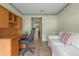 Inviting home office featuring built-in desk, comfortable seating, and bright, natural light at 4830 Summerbridge Cir, Leesburg, FL 34748