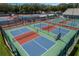 Aerial view of multiple pickleball courts, perfect for active community living at 4830 Summerbridge Cir, Leesburg, FL 34748