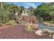 Scenic community waterfall feature with lush landscaping at 4830 Summerbridge Cir, Leesburg, FL 34748