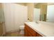Well lit bathroom with a shower-tub combination and neutral tones offers a clean aesthetic at 4954 Alavista Dr, Orlando, FL 32837
