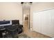 Bedroom featuring a ceiling fan, closet and trim work with adjacent hallway and doorway at 4954 Alavista Dr, Orlando, FL 32837