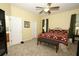 The bedroom features a large bed, carpeted floors, and view to a bathroom at 4954 Alavista Dr, Orlando, FL 32837
