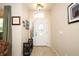 Bright foyer with tile flooring, decorative lighting, and a bench with shoe storage for convenience at 4954 Alavista Dr, Orlando, FL 32837