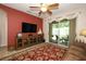 The living room features a ceiling fan and a sliding glass door to a patio with seating at 4954 Alavista Dr, Orlando, FL 32837