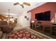 Bright living room leads to an open concept kitchen with wooden cabinets and dining area at 4954 Alavista Dr, Orlando, FL 32837