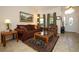 Cozy living room featuring neutral walls, a comfortable sofa, area rug and natural light at 4954 Alavista Dr, Orlando, FL 32837