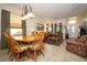 Open-concept living space with tiled floors, comfortable seating, dining area, and natural lighting at 4954 Alavista Dr, Orlando, FL 32837