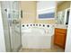 A relaxing main bathroom features a glass shower, soaking tub, and a vanity at 4954 Alavista Dr, Orlando, FL 32837