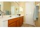 The main bathroom features a vanity with double sinks and a large mirror at 4954 Alavista Dr, Orlando, FL 32837