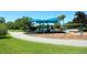 Community playground featuring swings, slides, and a covered picnic area, perfect for outdoor fun at 4954 Alavista Dr, Orlando, FL 32837