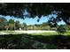 Well-maintained sand volleyball court surrounded by lush greenery and trees, offering a recreational space at 4954 Alavista Dr, Orlando, FL 32837