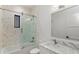 Bathroom featuring designer tile, glass enclosed shower and marble vanity at 5199 Latrobe Dr, Windermere, FL 34786