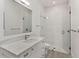 Clean, modern bathroom featuring a glass shower with white tile and a marble countertop at 5199 Latrobe Dr, Windermere, FL 34786