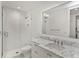 Bathroom featuring marble countertop, under-mount sinks, and glass-enclosed shower at 5199 Latrobe Dr, Windermere, FL 34786