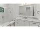 Bathroom featuring marble countertop, under-mount sink, and glass-enclosed shower at 5199 Latrobe Dr, Windermere, FL 34786