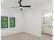 Bright bedroom with plantation shutters and ensuite bathroom at 5199 Latrobe Dr, Windermere, FL 34786
