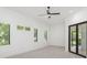 Bright bedroom with large windows, a ceiling fan, and access to an outdoor area at 5199 Latrobe Dr, Windermere, FL 34786