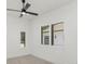 Well-lit bedroom showcasing windows with plantation shutters at 5199 Latrobe Dr, Windermere, FL 34786