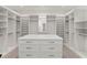 Spacious walk-in closet with custom shelving and storage solutions, featuring a central island at 5199 Latrobe Dr, Windermere, FL 34786