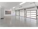 Spacious three-car garage with epoxy floors and modern doors at 5199 Latrobe Dr, Windermere, FL 34786