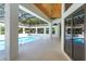 Outdoor pool area features open patio, ceiling fan, and screened-in enclosure at 5199 Latrobe Dr, Windermere, FL 34786
