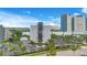 High-rise condominium complex featuring well-kept grounds and ample parking space at 6165 Carrier Dr # 2605, Orlando, FL 32819