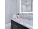Modern bathroom with a sleek vanity and bright, illuminated mirror at 6165 Carrier Dr # 2605, Orlando, FL 32819