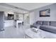 Inviting living space featuring a modern kitchen, cozy seating, and stylish decor at 6165 Carrier Dr # 2605, Orlando, FL 32819